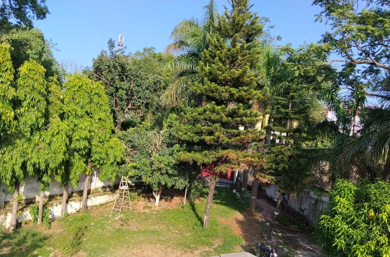 Open compound with hill backdrop